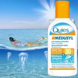 Lait solaire Quies dans presentoir