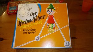 Vieux jouet an80 "der hochradfahrer " Clown sur un vélo avec ficelle