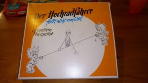 Vieux jouet an80 "der hochradfahrer " Clown sur un vélo avec ficelle